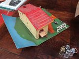 a paper model of a house on a table