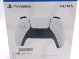 the box of a sony playstation controller is open on a white surface
