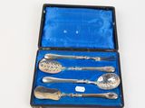 a silverware set in a blue case on a table