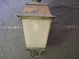 a light that is hanging from the side of a wall