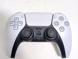 a close up of a video game controller on a table