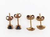 three pairs of gold and black diamond earrings on a white background