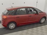 a red car that is parked in a garage