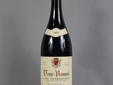 a bottle of wine that is sitting on a table