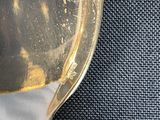 a close up of a spoon with a liquid in it