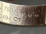 a close up of a silver ring with a date on it