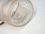 an image of a glass vase with a label on it