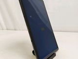 a close up of a tablet computer on a stand on a white surface