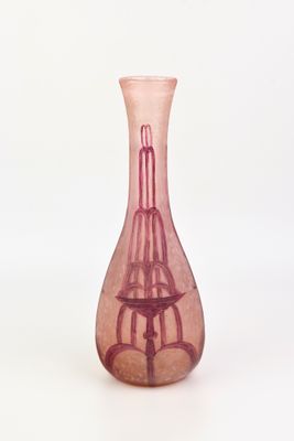 a pink glass vase with a birdcage on it