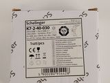 the back of a white box with a black and white sticker on it