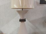 a lamp that is sitting on a table in a room
