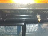 an open oven with a door that has a key in it