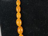 a close up of a necklace on a mannequin mannequin