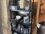 a black shelf that has many containers and containers on it