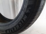 a close up of a tire on a white surface