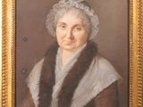 portrait of an old woman in a fur stole and a white bonnet