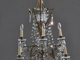 an image of a chandelier with three lights hanging from the ceiling