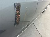 a sticker on the side of a car with a ruler on it