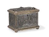 a large silver metal box with a design of figures on it