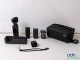 a black bag with a camera and other items in it