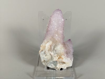 a small piece of rock that is sitting on a stand