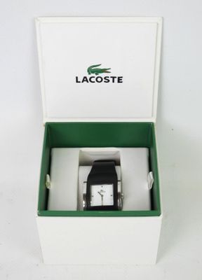 a box with a watch inside of it on a white surface