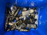 a blue plastic container filled with black and white items