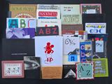 many books on a black table with a black background