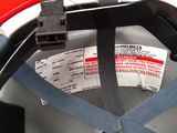 a helmet with a label on it and a tag attached to it