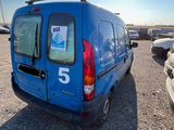 a blue van that is parked in a parking lot