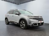 the new citrole suv is parked in a large room