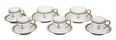 six cups and saucers with gold trimmings on them