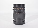a close up of a camera lens on a white surface
