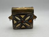 an image of a small box with a cross design on it