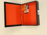 an open box with a card in it on a table