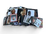 a lot of books that are stacked on top of each other