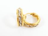 a close up of a gold and silver ring on a white background