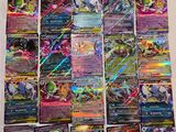 a pile of pokemon cards sitting on top of a table
