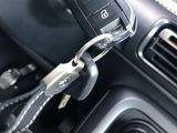 a close up of a car dashboard with a key in it