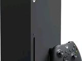 un gros plan sur une console Xbox noire et une manette
