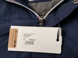 a close up of a jacket with a tag attached to it