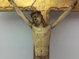 a statue of jesus on the cross on a table