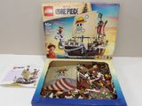a box of legos with a pirate ship inside of it