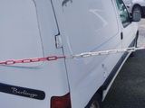 a white van that is parked in a parking lot