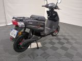 a scooter that is parked in a garage