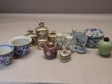 many different types of vases and bowls on the table