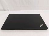 a black laptop on a white surface with a white background