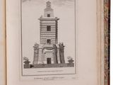 an open book with a drawing of a tower in the middle of it