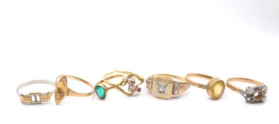 six different types of rings on a white surface