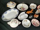 many different types of dishes and bowls on the table